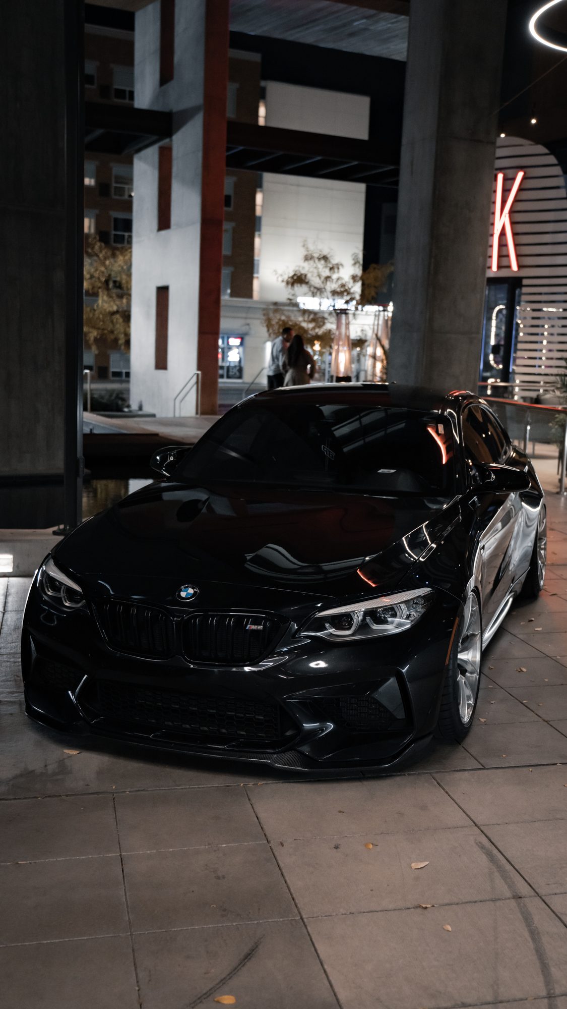Black M2 parked at night